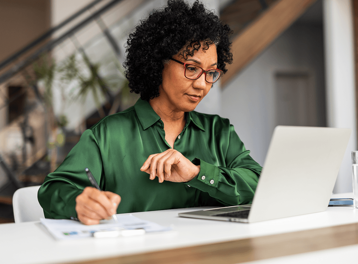 Experienced Professional Working at Desk Laptop