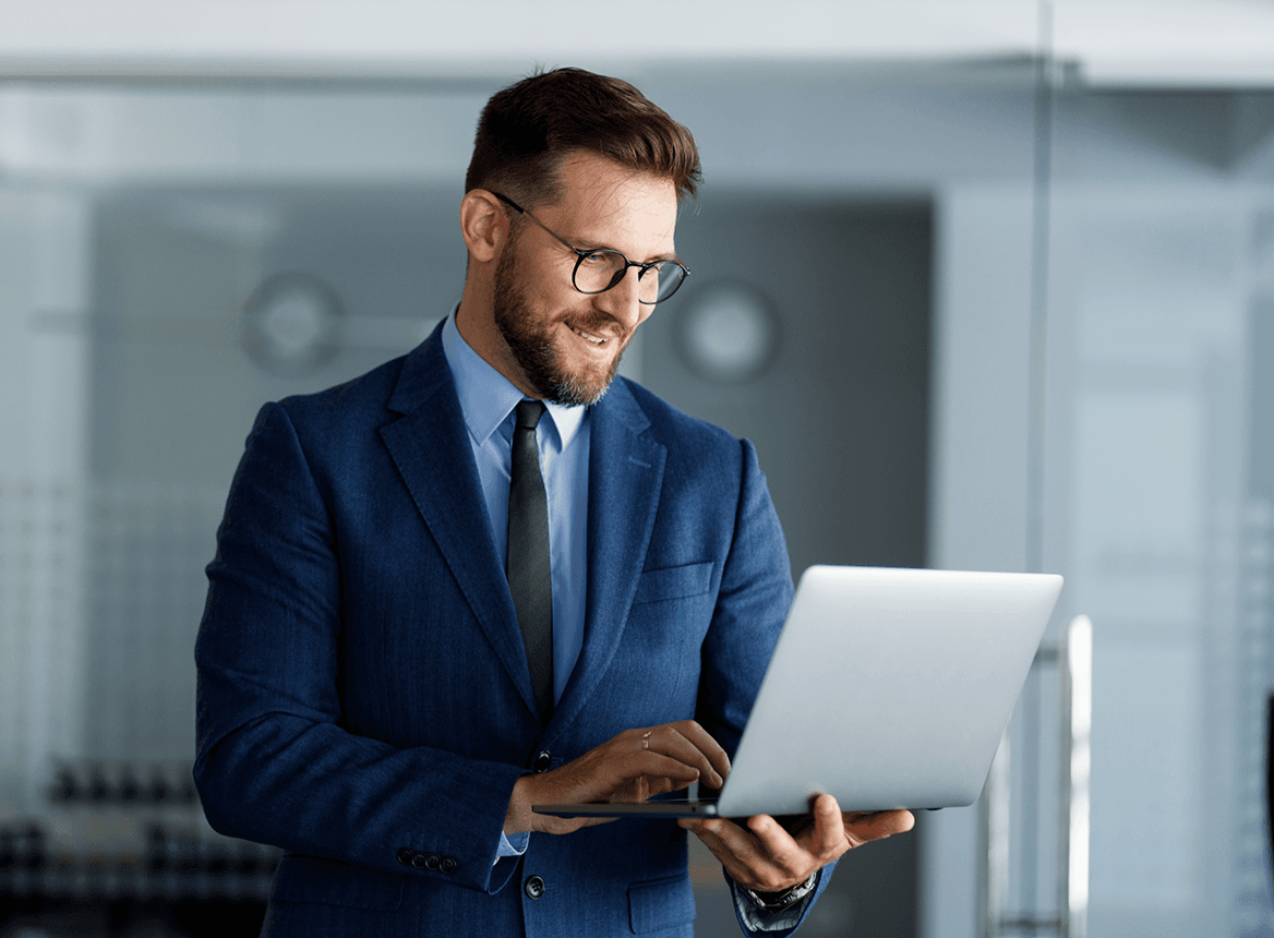 Business Professional Using Laptop Standing